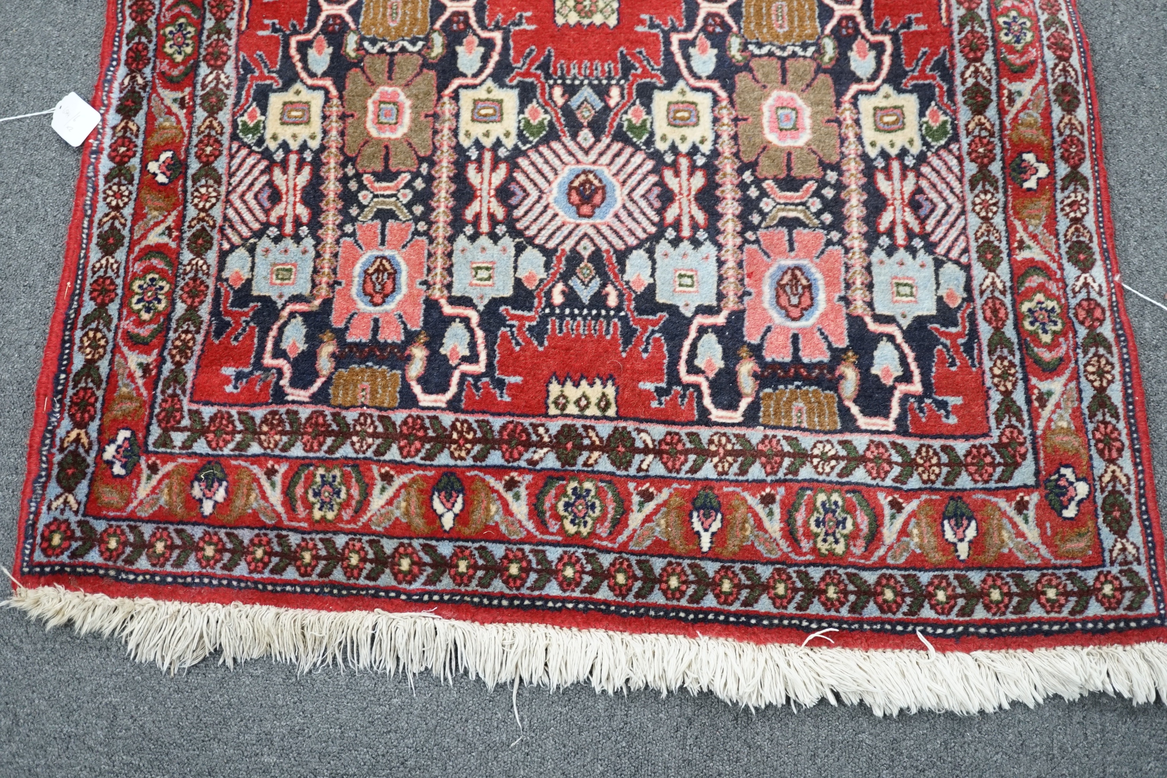 A North West Persian blue ground geometric runner 390cm x 88cm